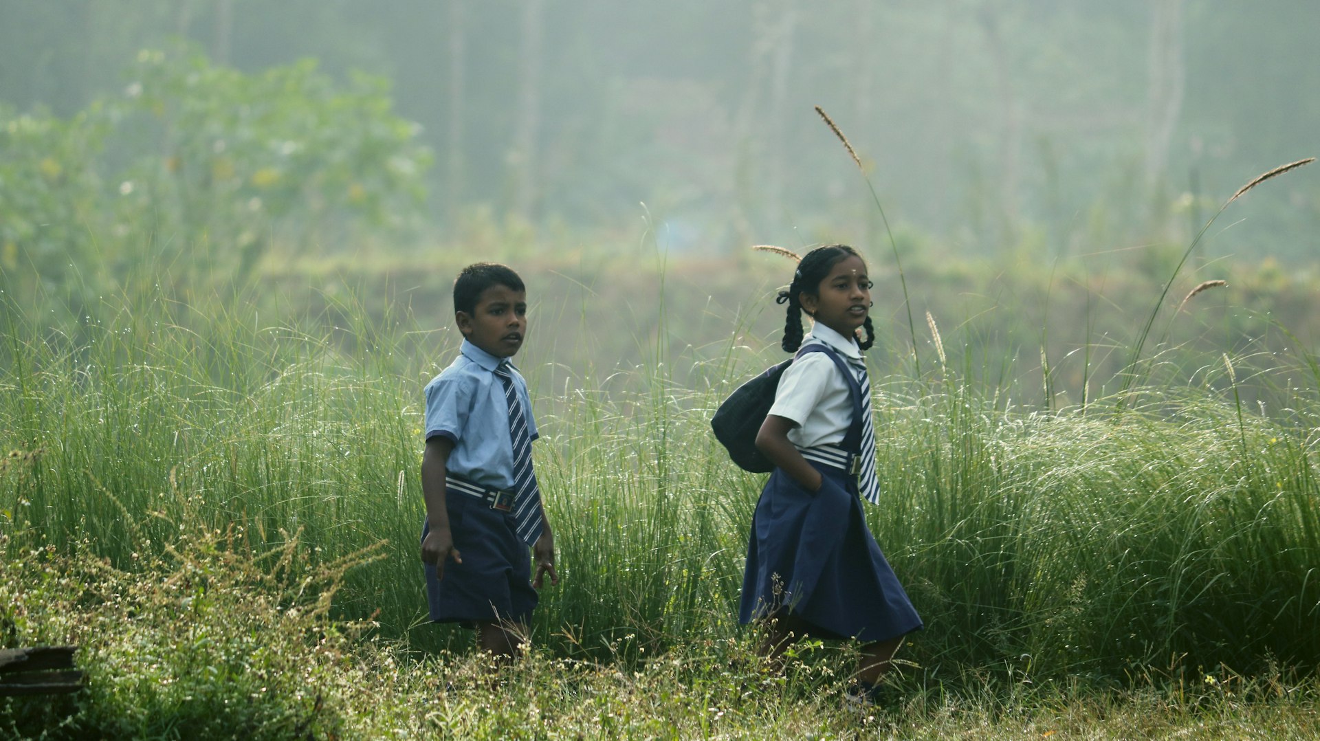 a couple of young girls standing next to each other